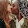 lovers-share-kiss-in-park-by-serene-water-2026-03-05-11-47-2