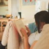 relaxed-woman-reading-book-on-a-comfortable-couch-2026-01-05