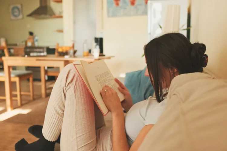 relaxed-woman-reading-book-on-a-comfortable-couch-2026-01-05